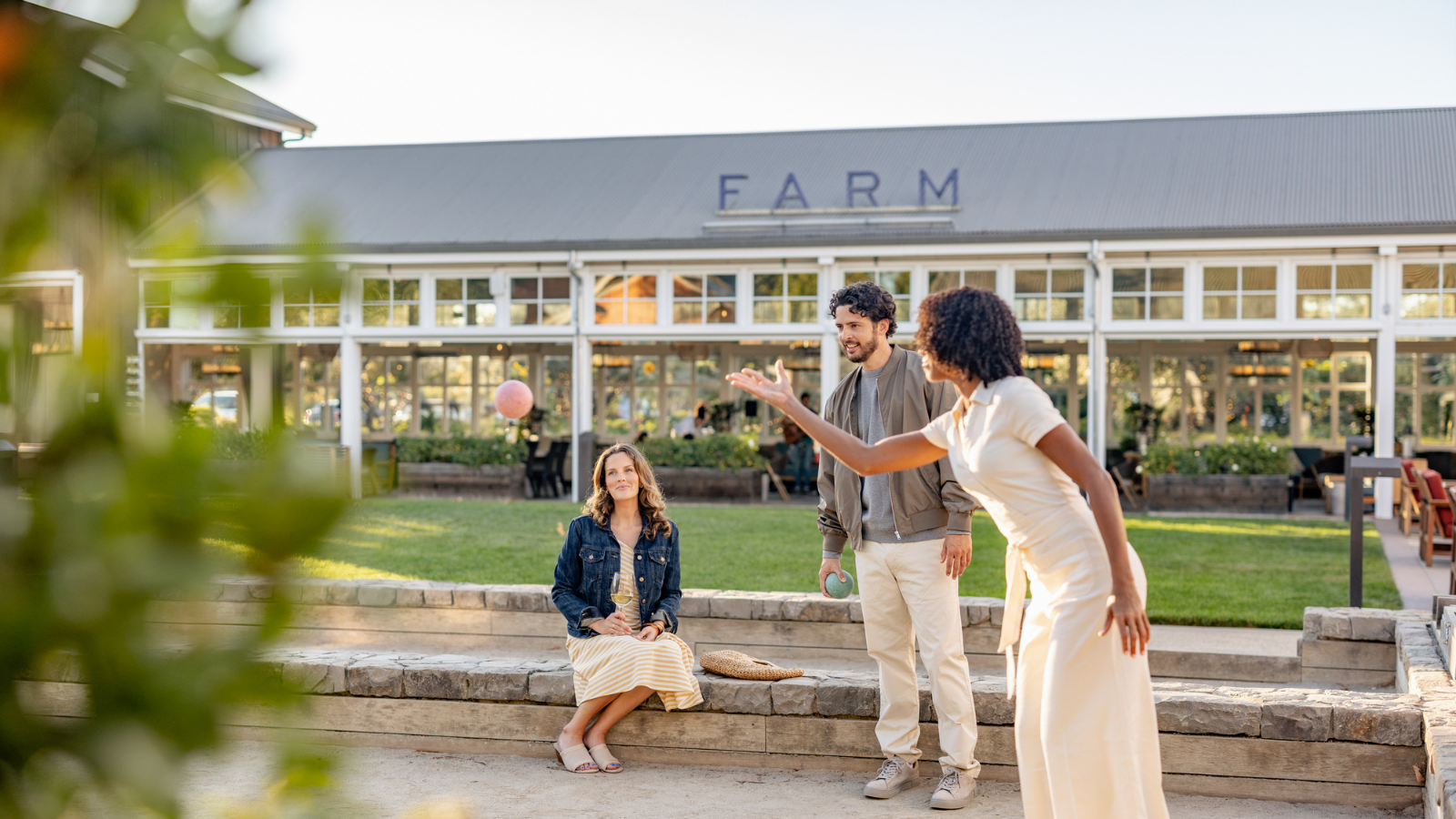 Three people are outside a building marked 